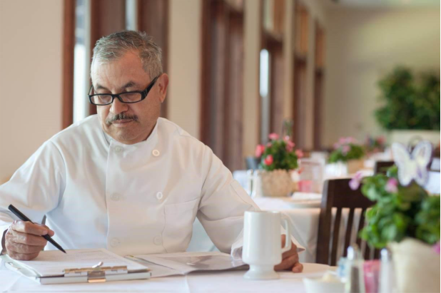 small business owner and chef reviewing debt collection letters