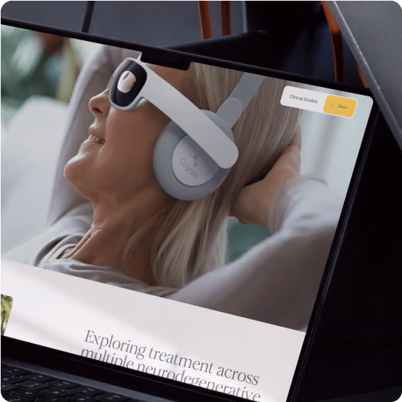 A laptop screen with a woman wearing headphones. 