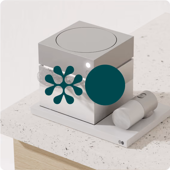 A small box with a green flower on it. 