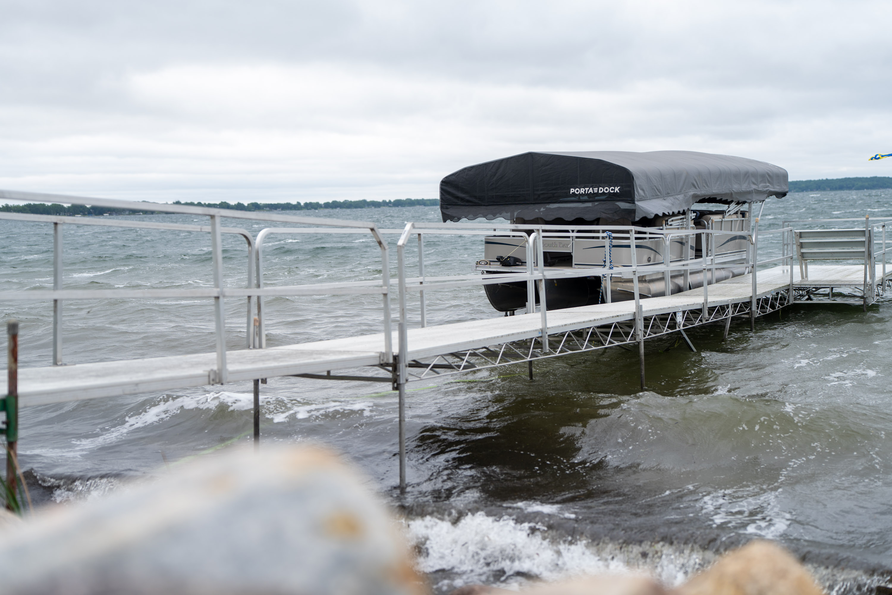 Image of rough waves and a solid Porta-Dock boat dock lift withstanding the waves
