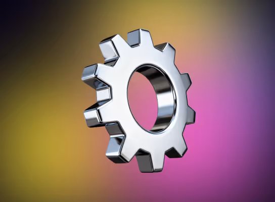 Glänzendes Metallgetriebe mit reflektierender Oberfläche vor einem verschwommenen gelb-lila Hintergrund.