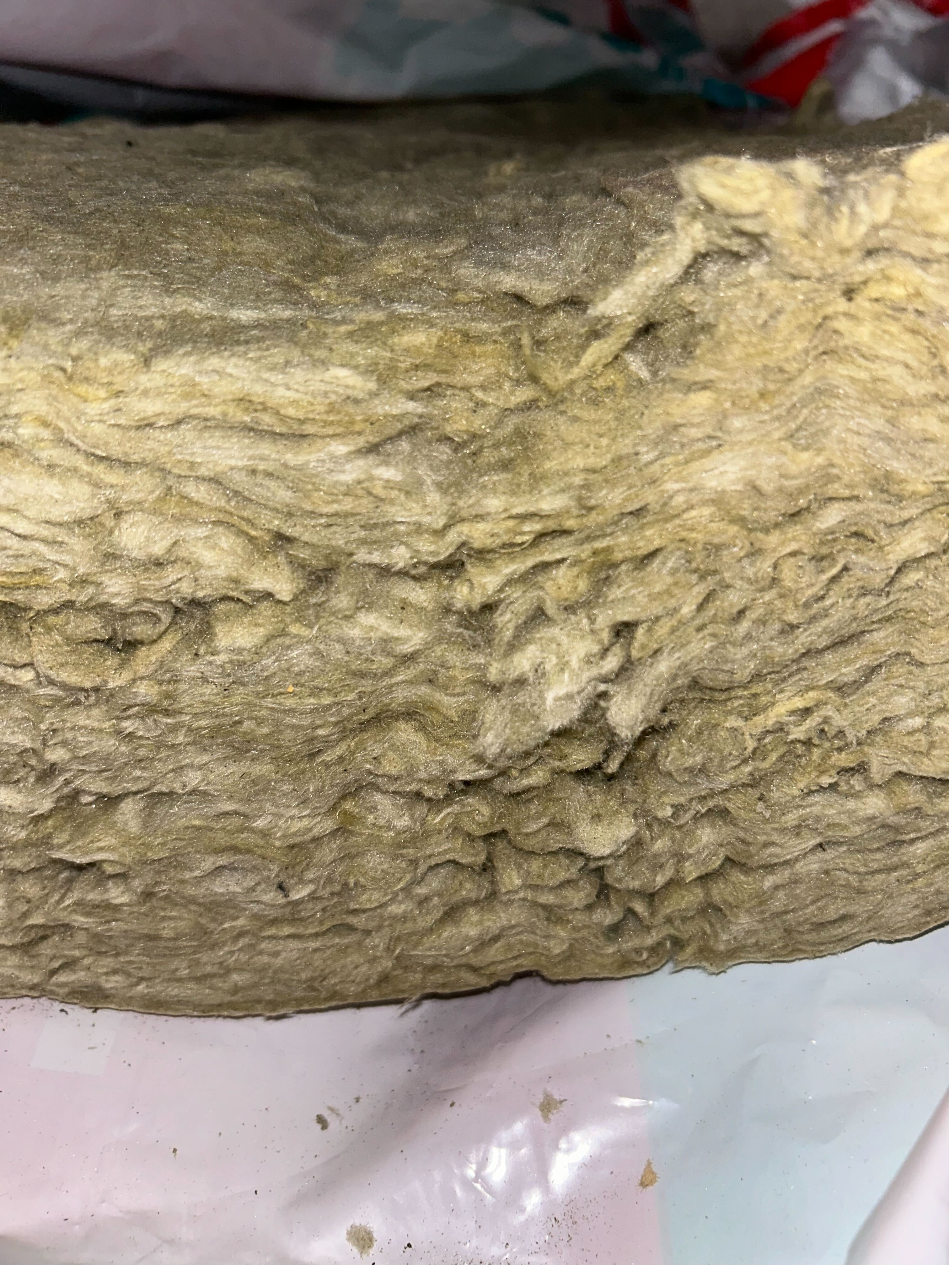 close-up of mineral wool insulation fibers showing layered texture
