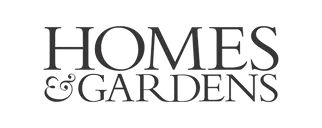 Black text logo saying 'HOMES & GARDENS' in uppercase serif font.
