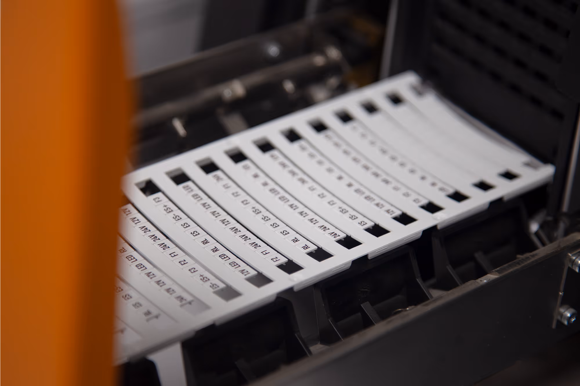 Close-up of custom wire and terminal identification labels for use in electrical control panels