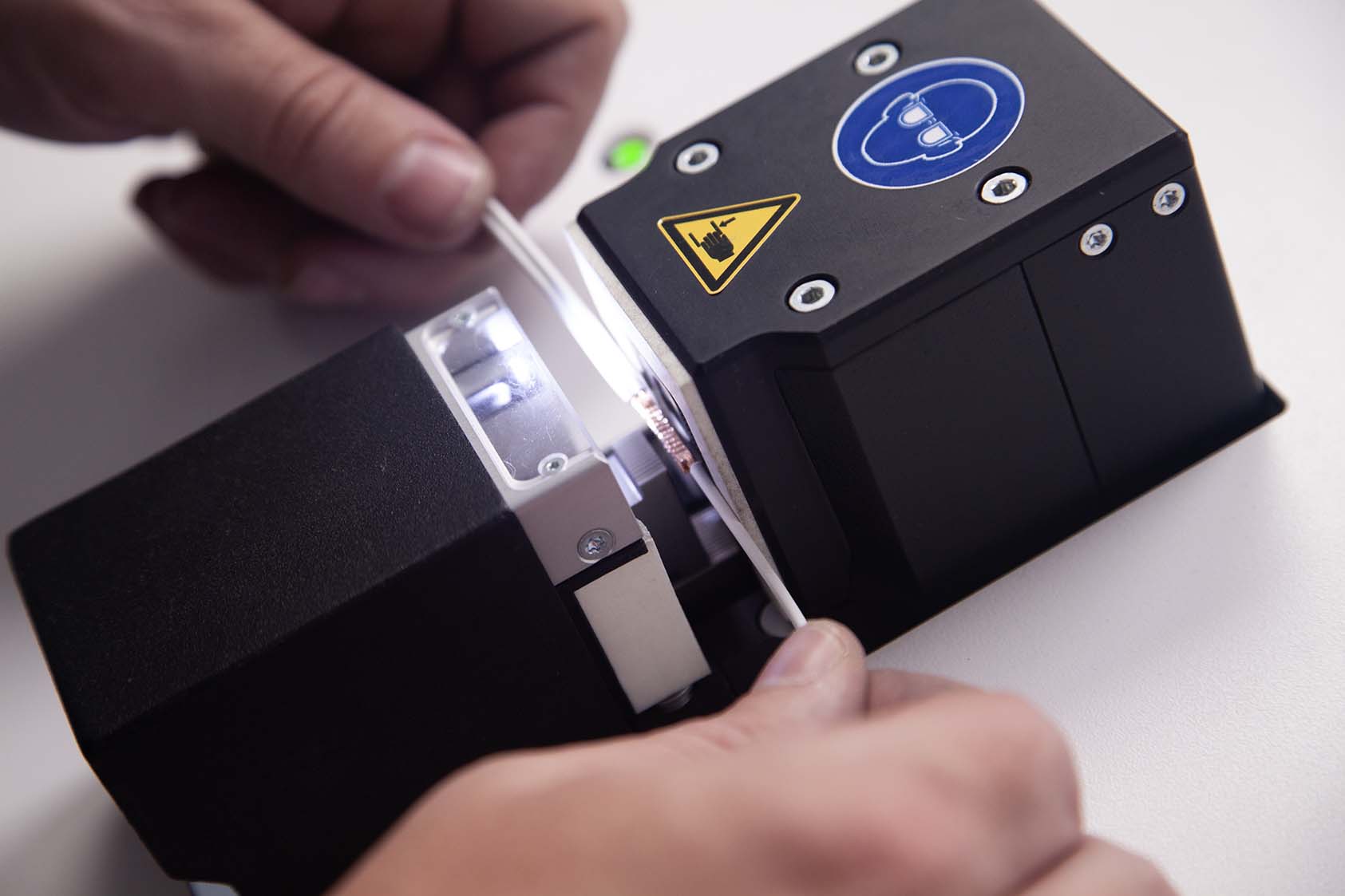Close-up of Tec-Stop technician using Telsonic ultrasonic welding equipment to join electrical cables without crimps or solder.