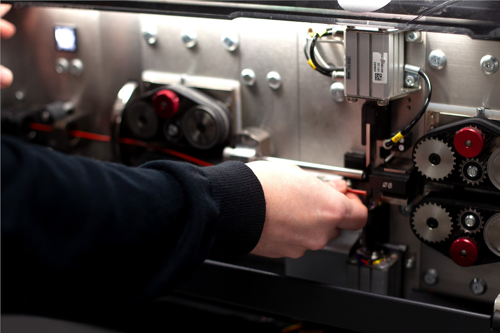 Automated wire cutting and stripping machine producing precision wiring assemblies for bespoke electrical solutions.