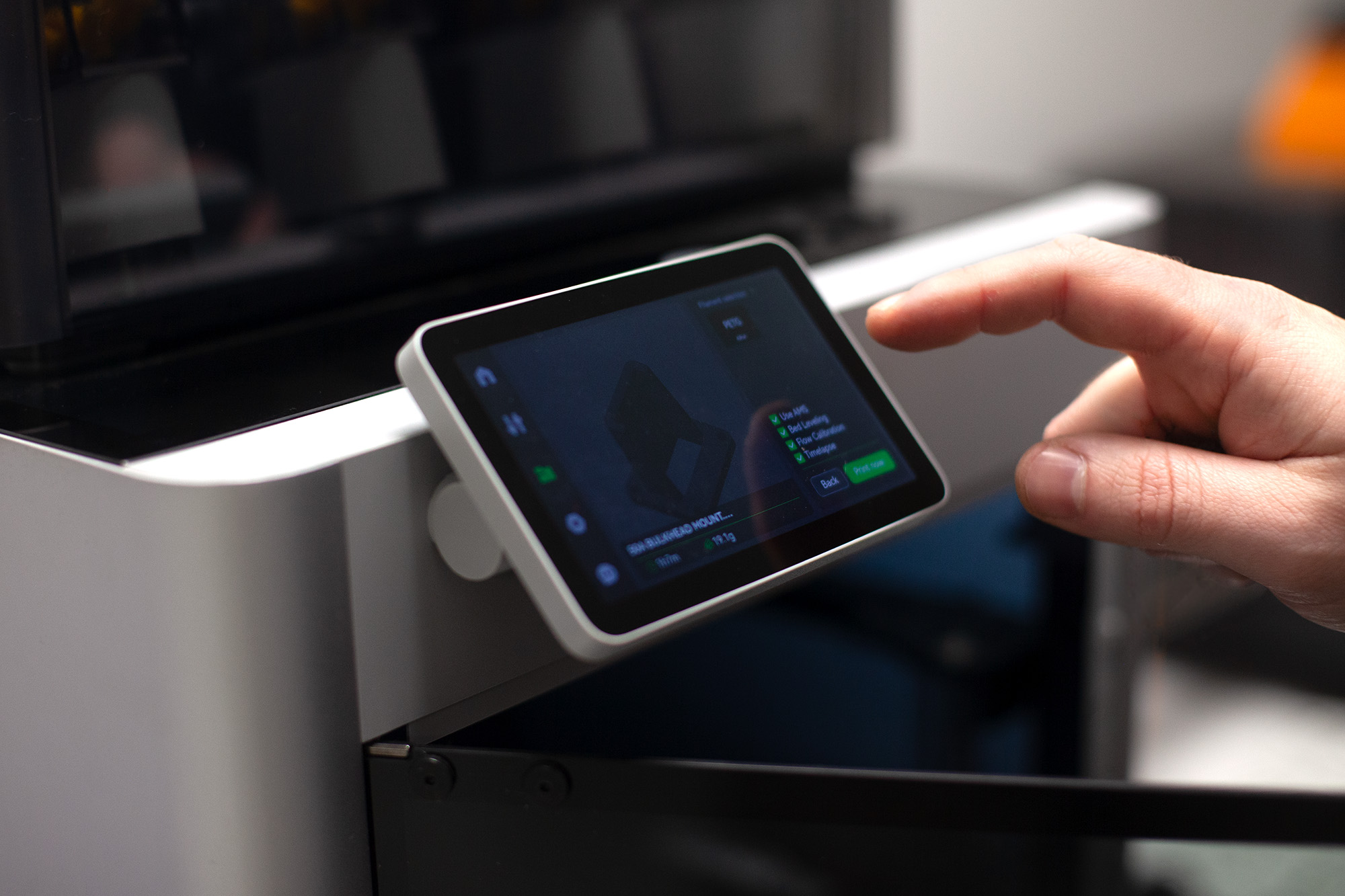 3D printing touchscreen showing AI-assisted design for custom wiring clamps and fixtures in UK manufacturing.