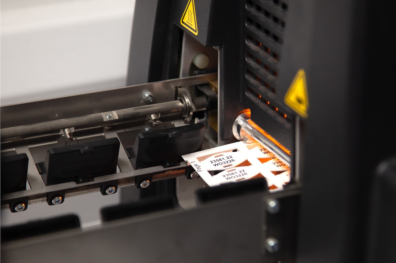 Thermal transfer printing system creating durable wire markers for industrial wiring assemblies.