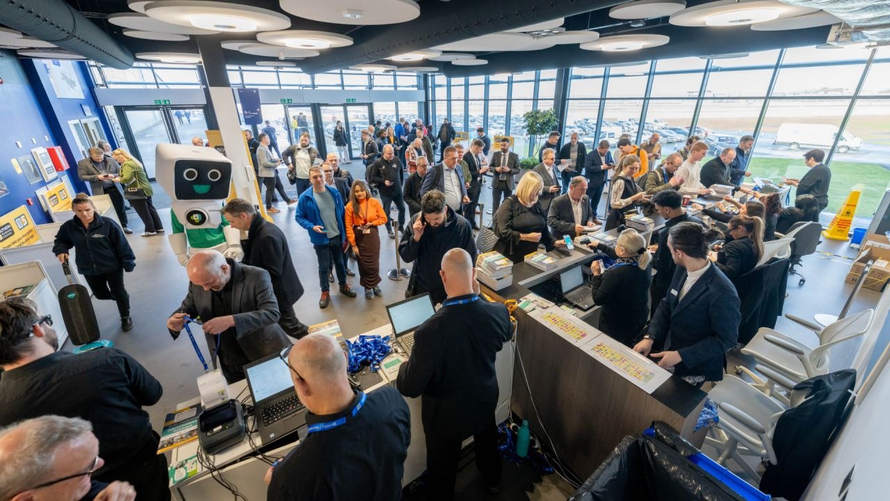 Manufacturing and electronics trade show networking with engineers and procurement teams assessing UK suppliers