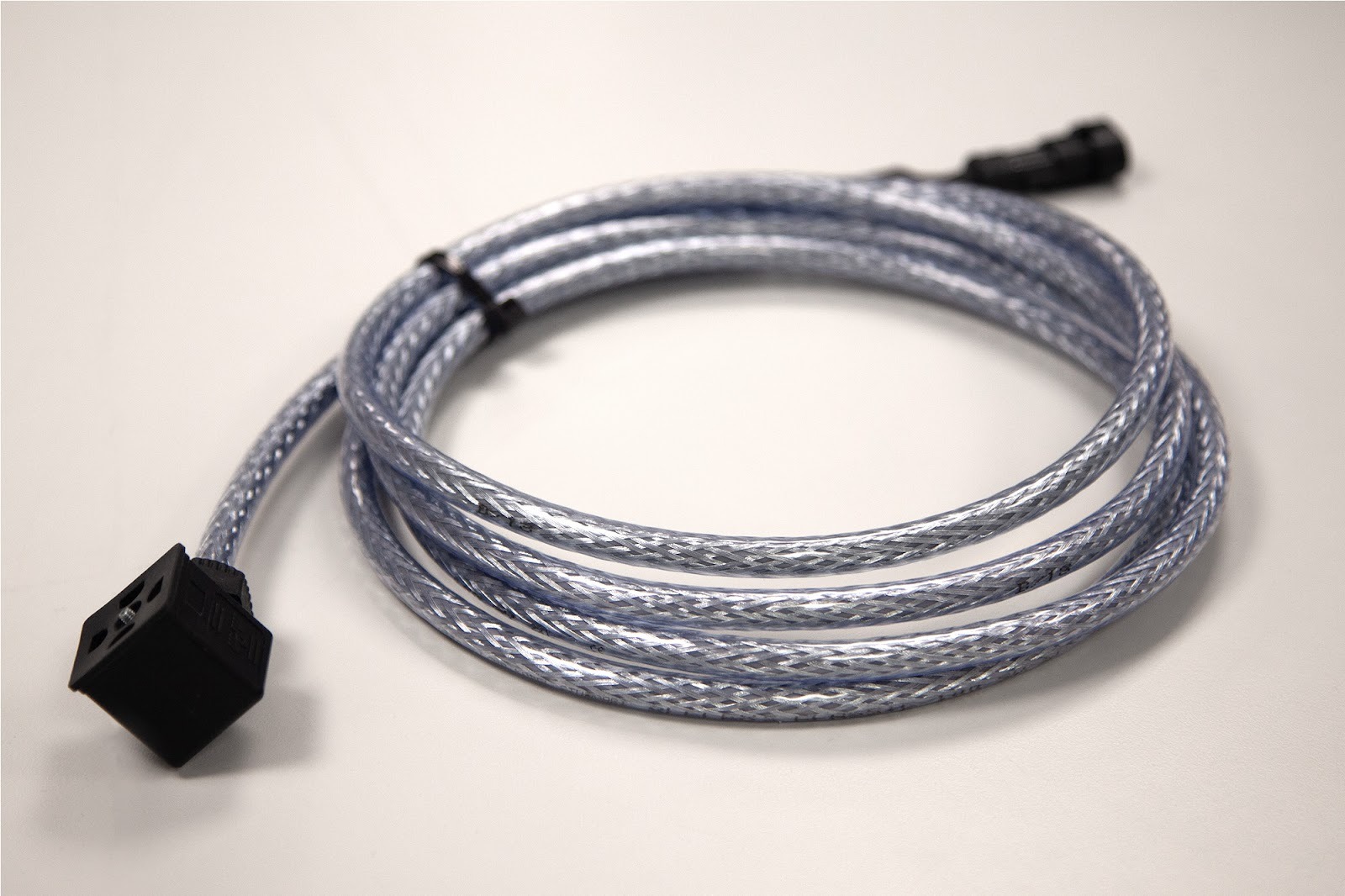 Custom cable assembly with braided protection and connectors for point-to-point electrical connection