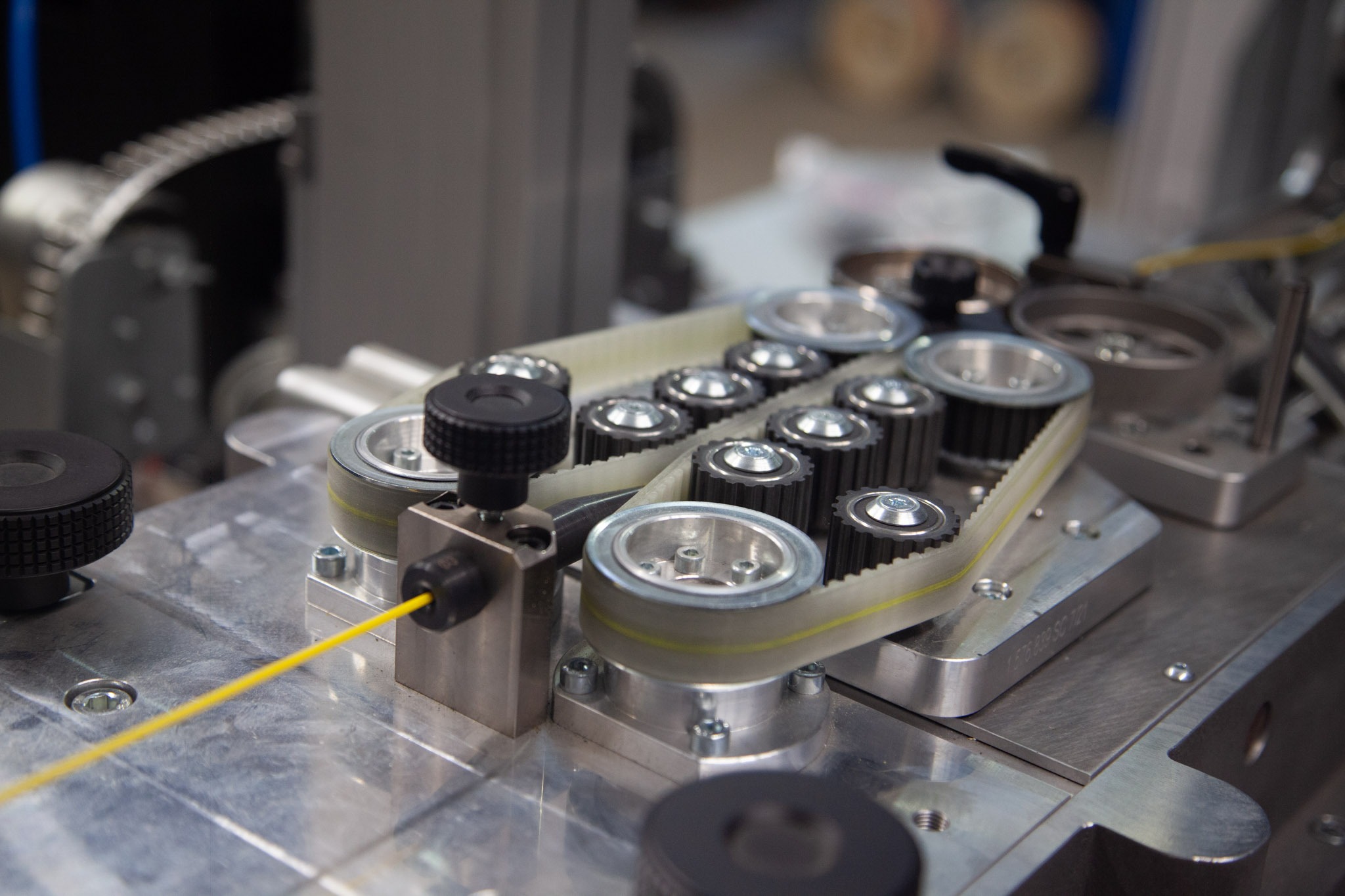 Cable feeding through precision wire processing machine used in cable assembly and harness manufacturing