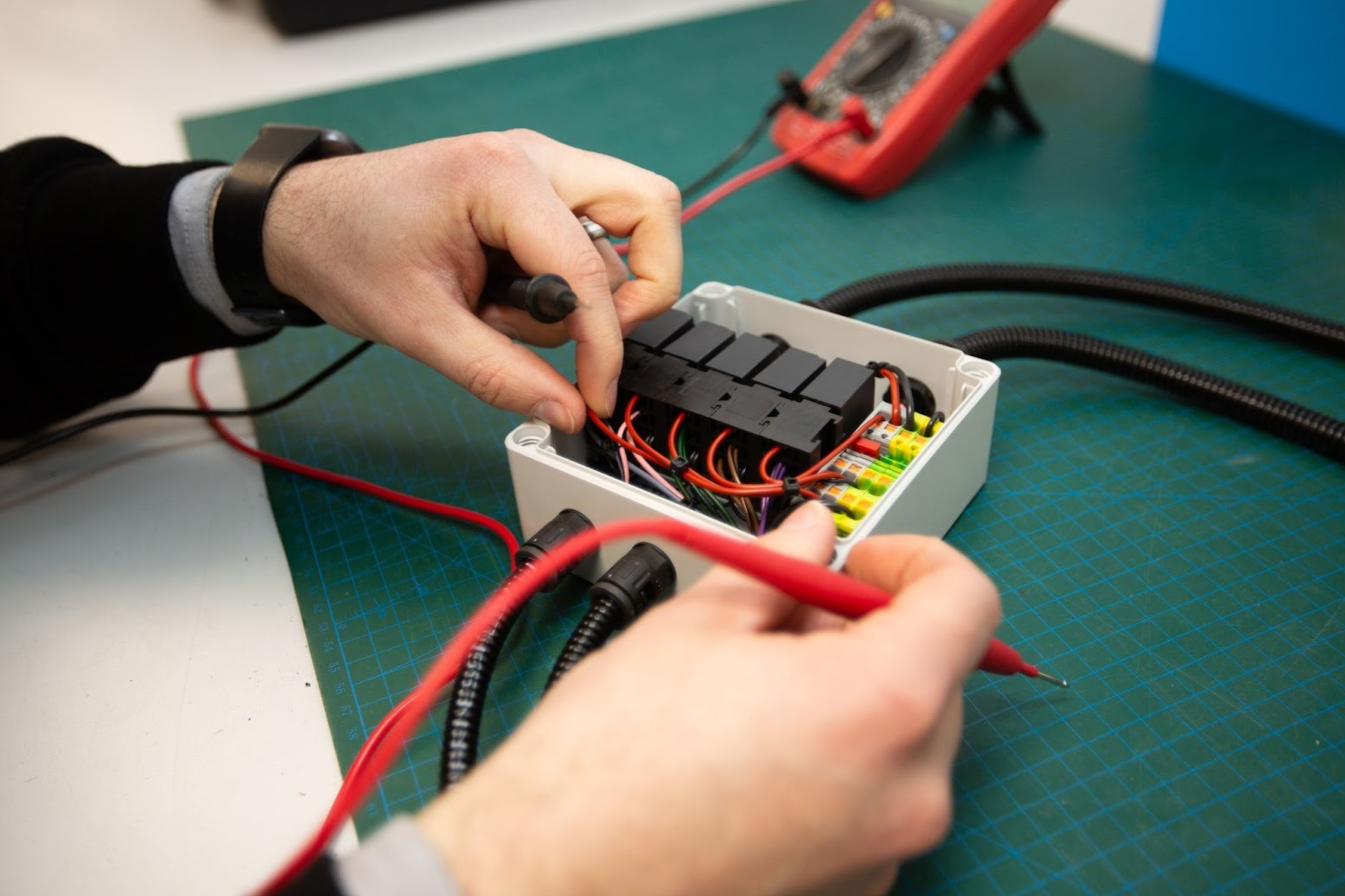Electrical panel functional testing using multimeter probes during OEM manufacturing