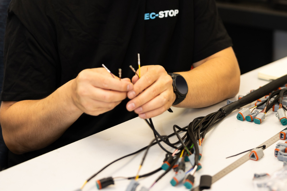 Precision connector termination during custom wiring harness manufacture