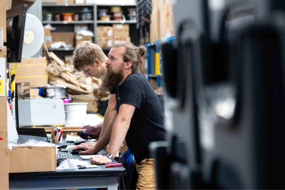 Tec-Stop technicians working at manufacturing workstations in Worcester