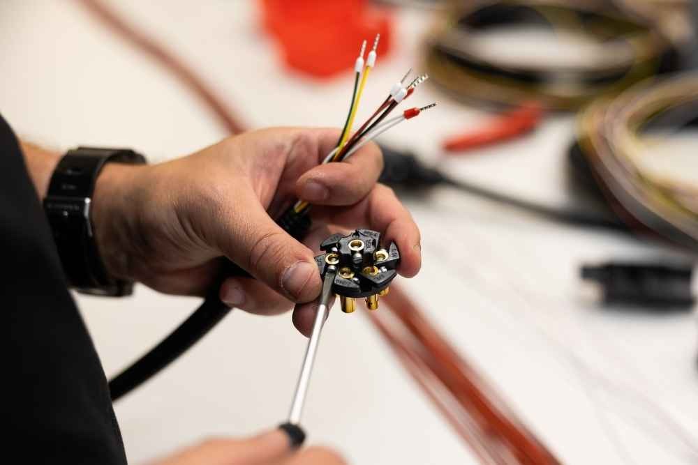 Close-up of wires and terminals during custom cable assembly