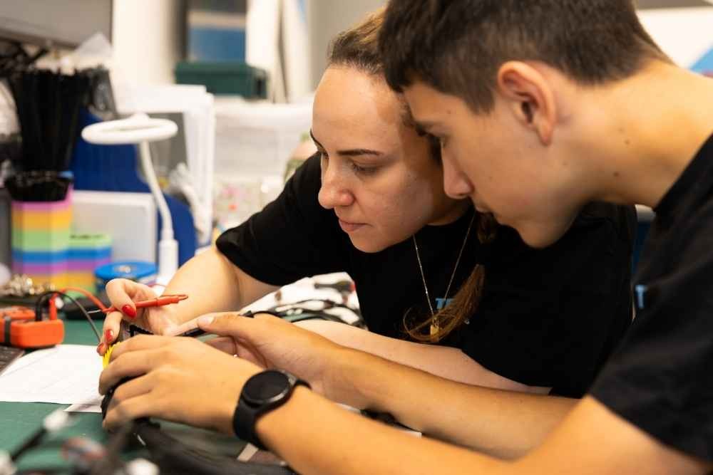 Tec-Stop technicians working together on a custom cable assembly