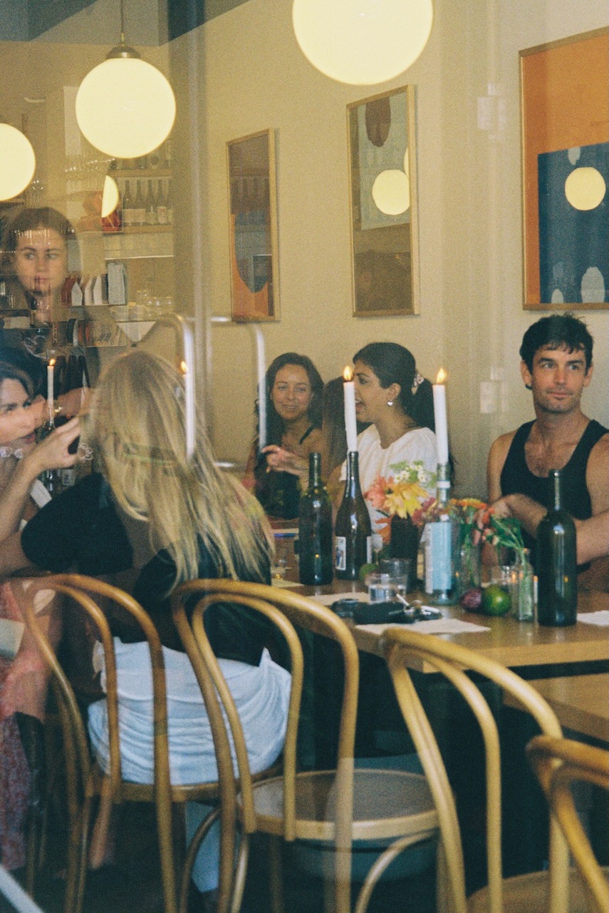 A buzzing table of guests, connecting for the first time