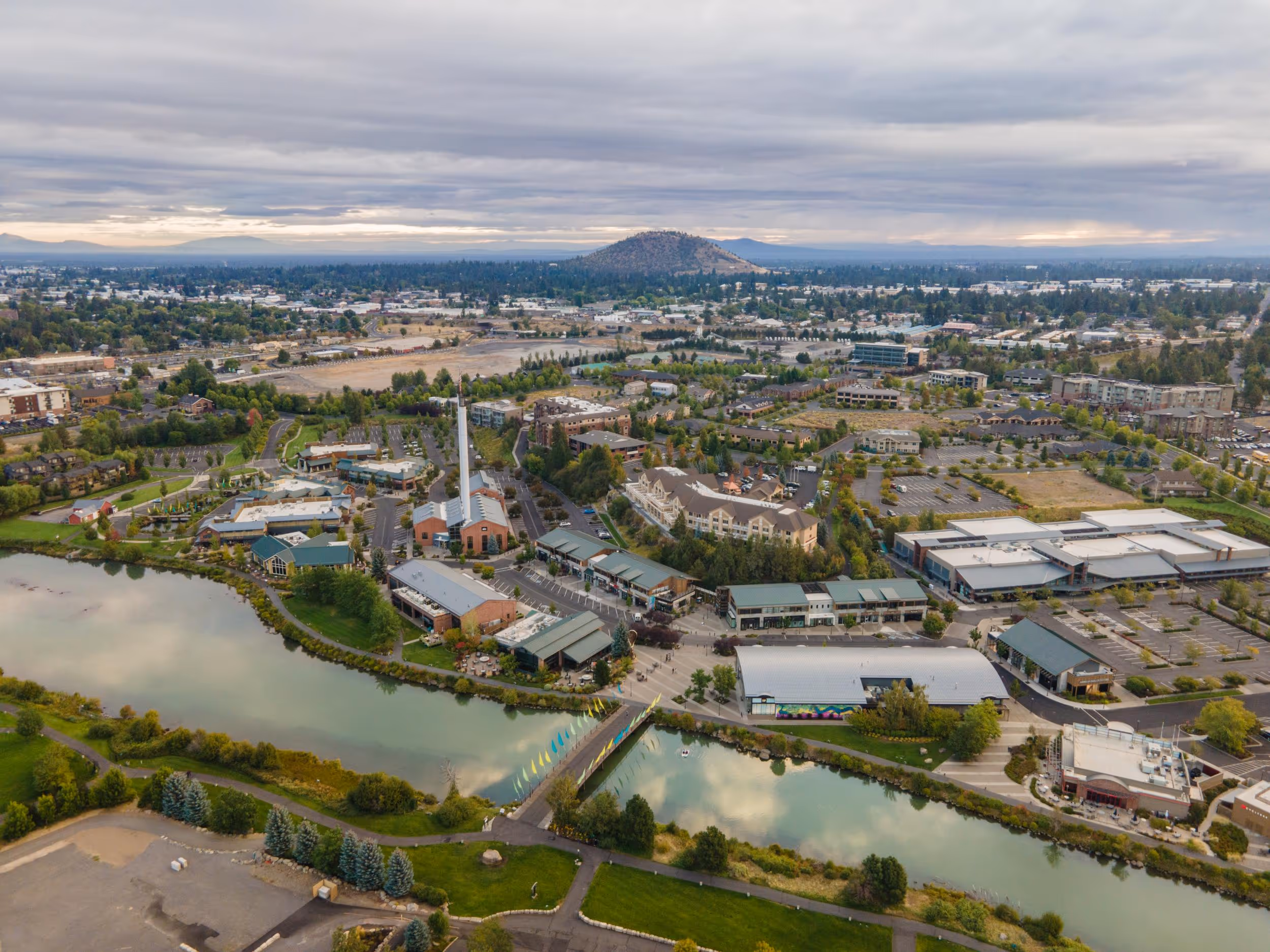 An aerial view of a city with a river running through it.