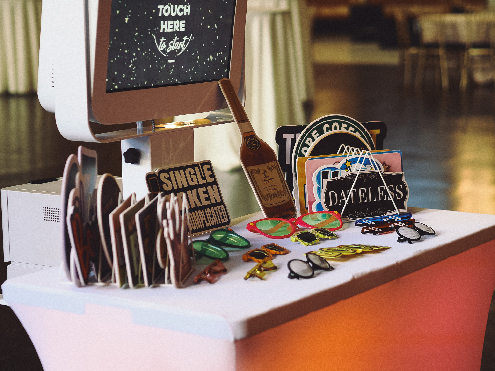 UrOn Photos booth and prop table prepared for an event