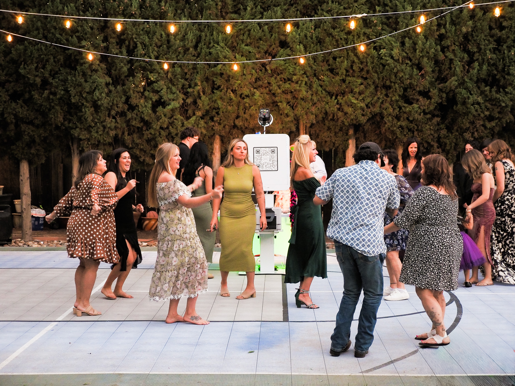 UrOn Photos booth in the middle of a dance floor surrounded by event guests