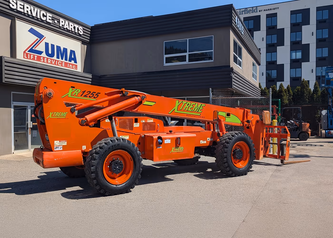 2017 Xtreme XR1255 Telehandler, orange, with retracted boom at Zuma Lift Service | rough terrain forklift