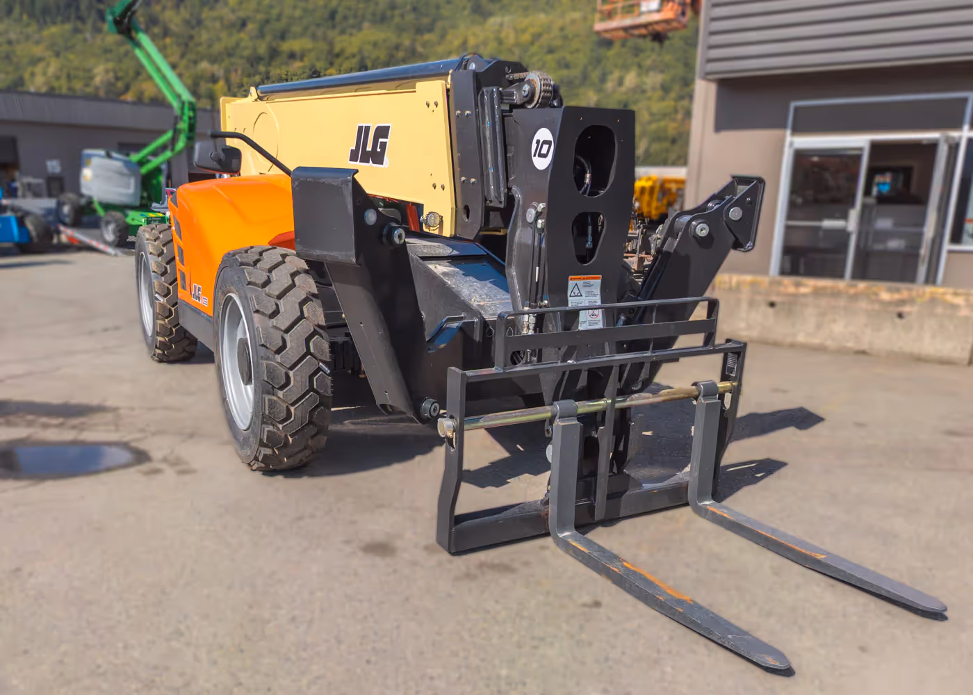  JLG 1055 telehandler front angle with forks extended in Canada