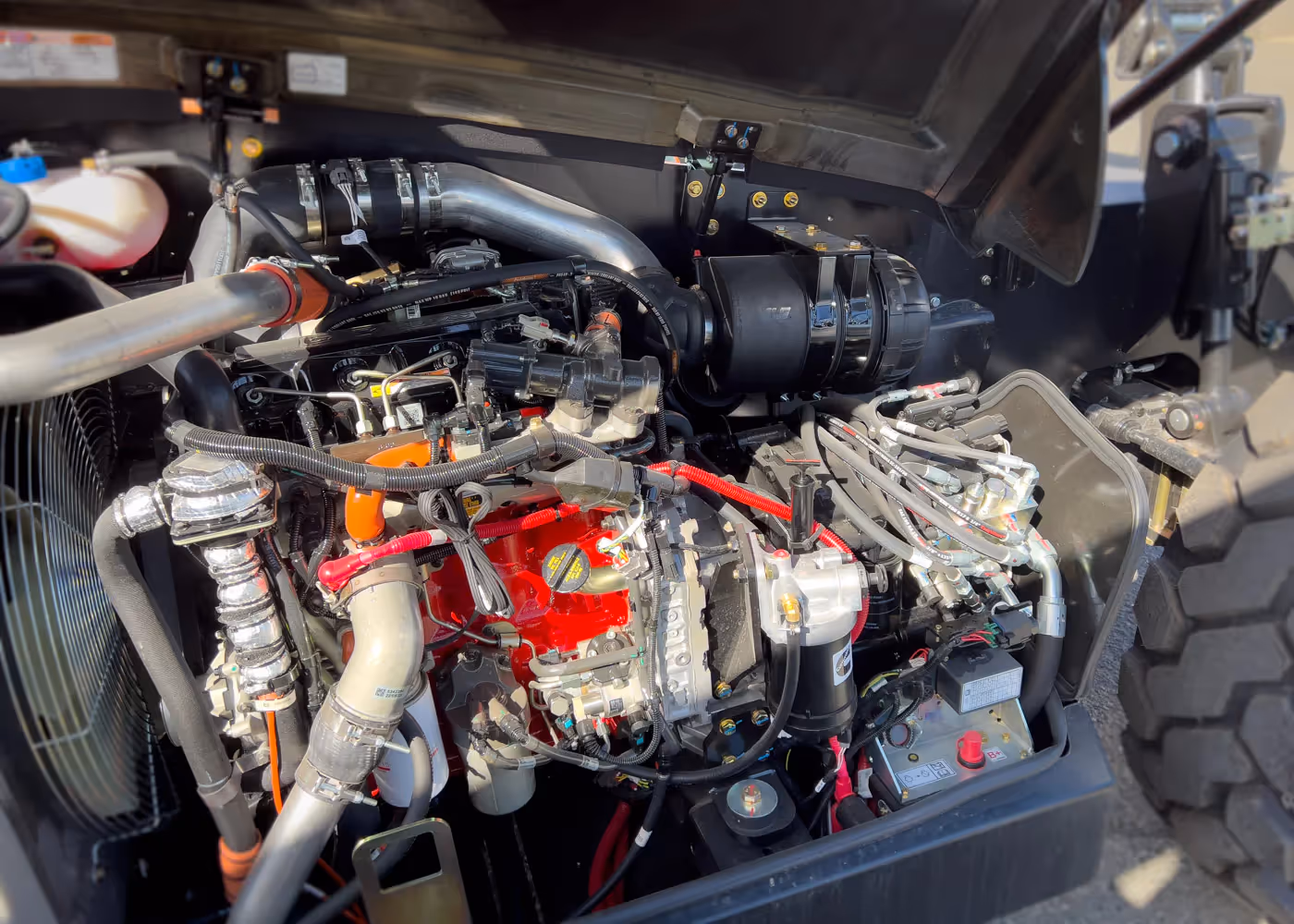   JLG 1055 telehandler engine compartment showing internal components in Canada