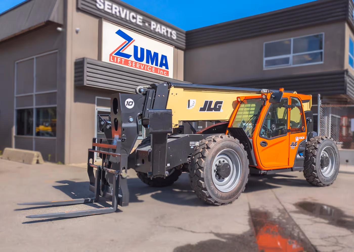  JLG 1055 telehandler front angle with forks extended in Canada