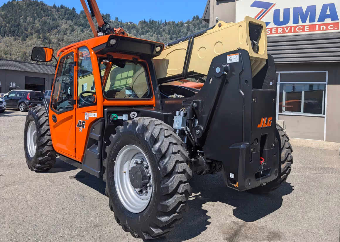 Rear three-quarter view of JLG 742 telehandler showing tire and boom base in Canada
