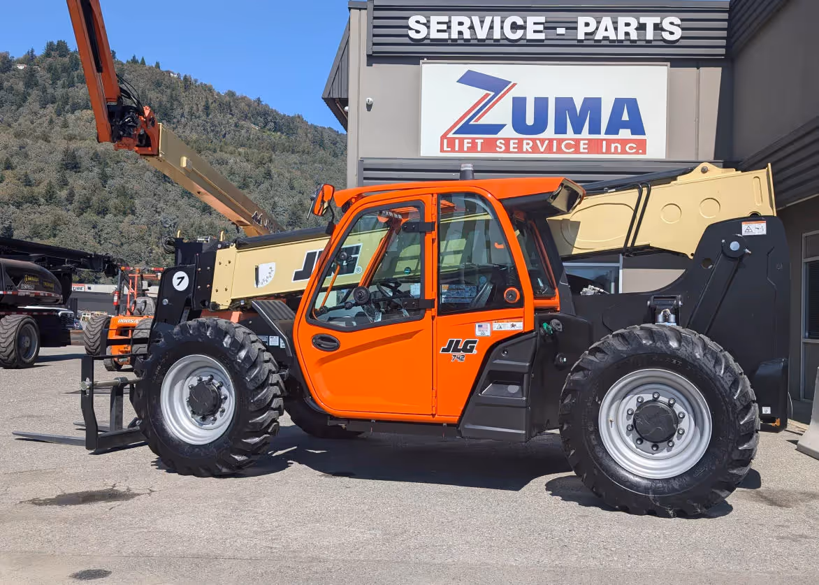 JLG 742 telehandler with raised boom and forks at Zuma Lift in Canada