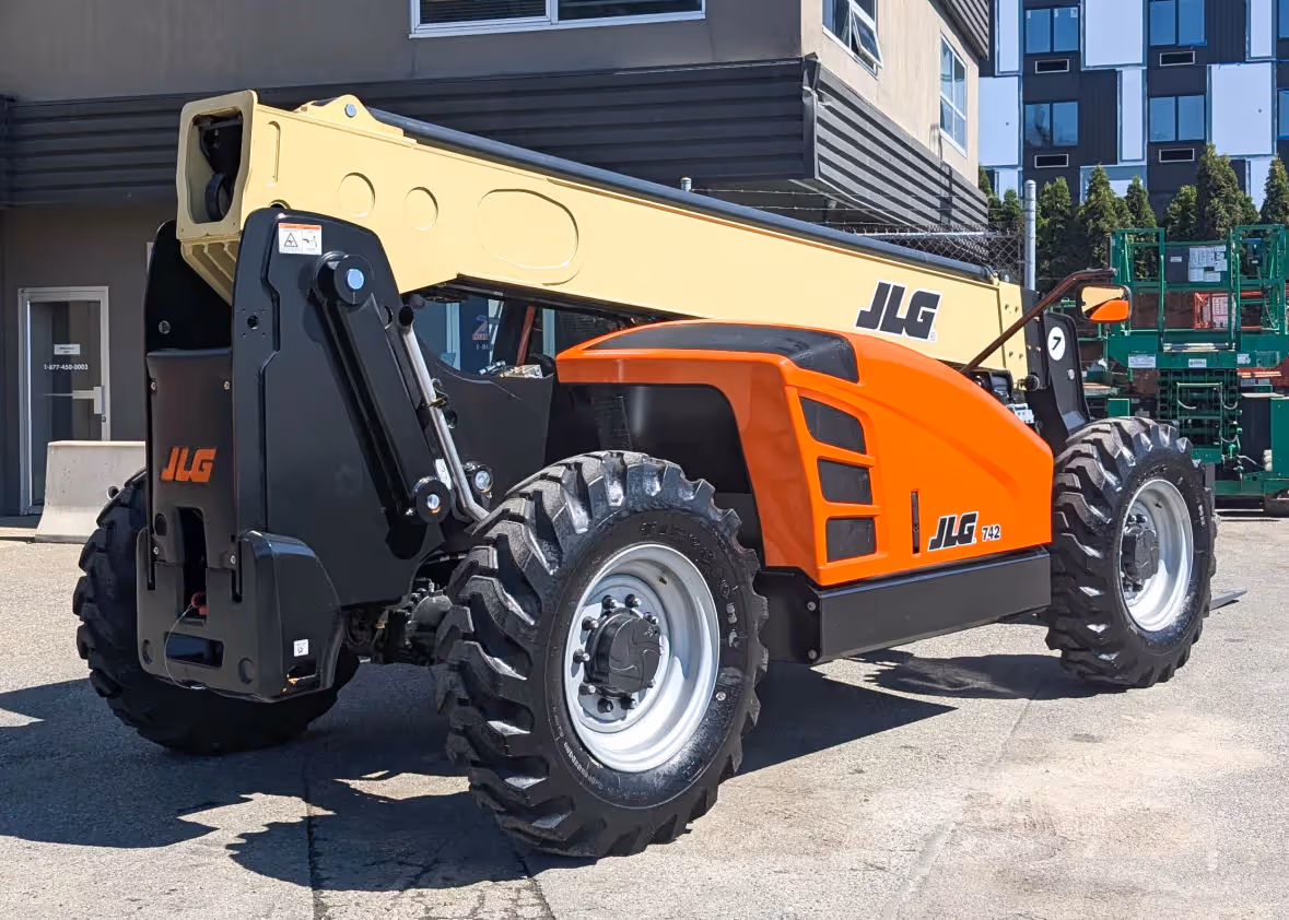 Rear view of JLG 742 telehandler parked at equipment yard in CanadaRear view of JLG 742 telehandler parked at equipment yard in Canada