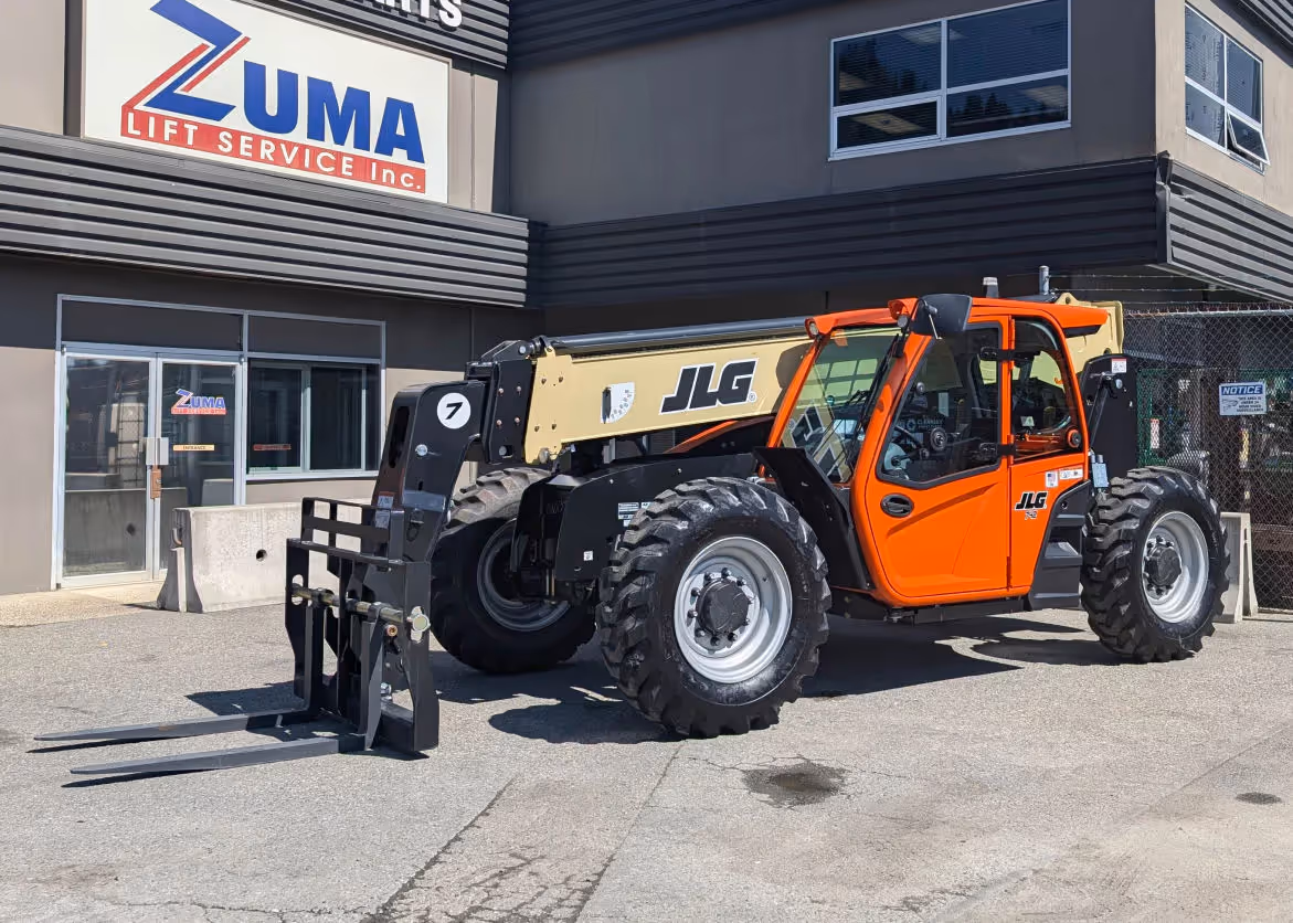 Front-side view of JLG 742 telehandler fully extended forks in Canada