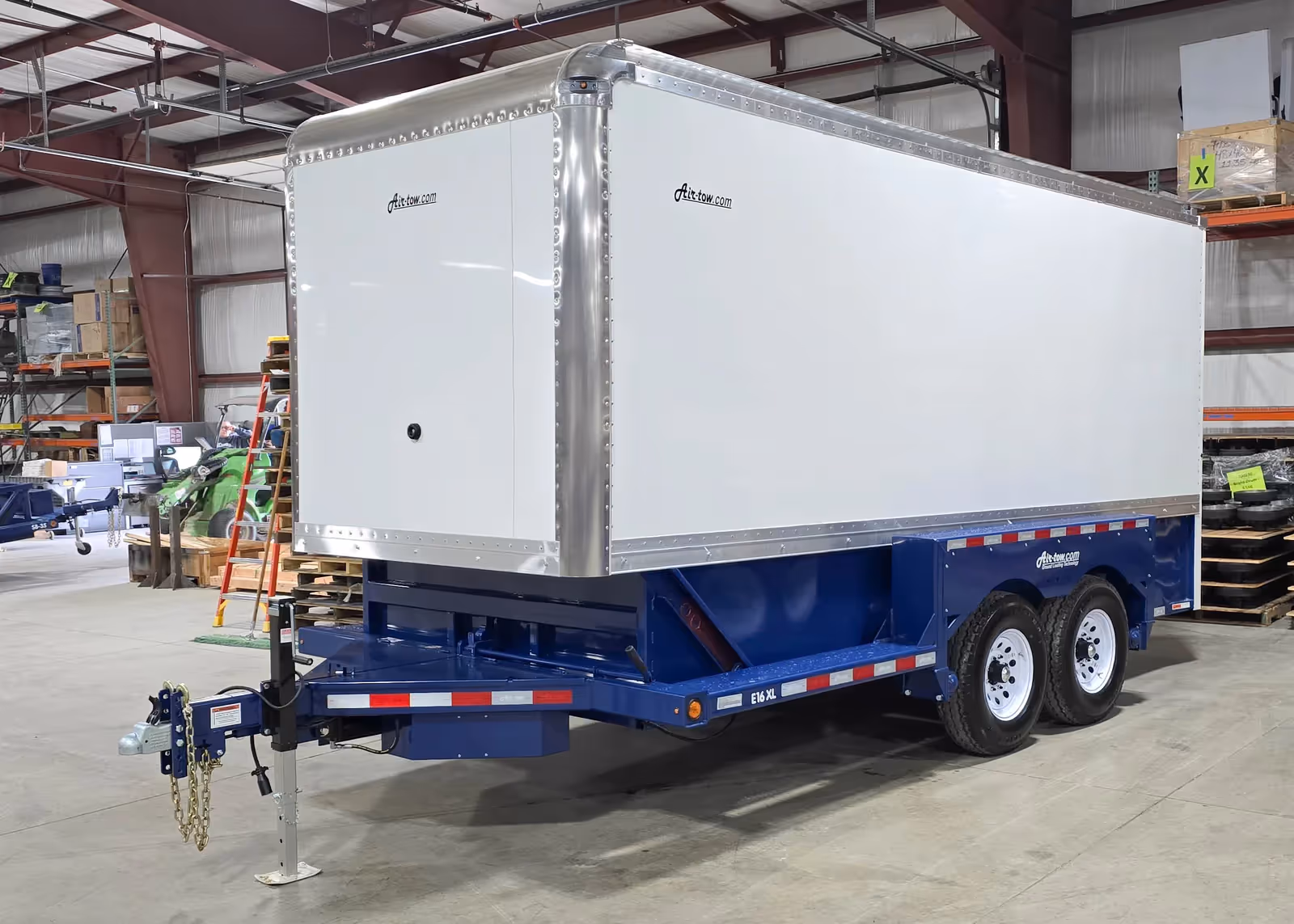 Air-Tow E16 XL enclosed trailer parked inside warehouse in Canada