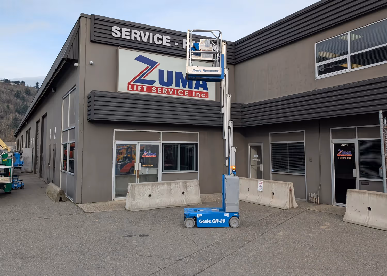 Genie GR-20 runabout extended mast lifting to signage height in Canada