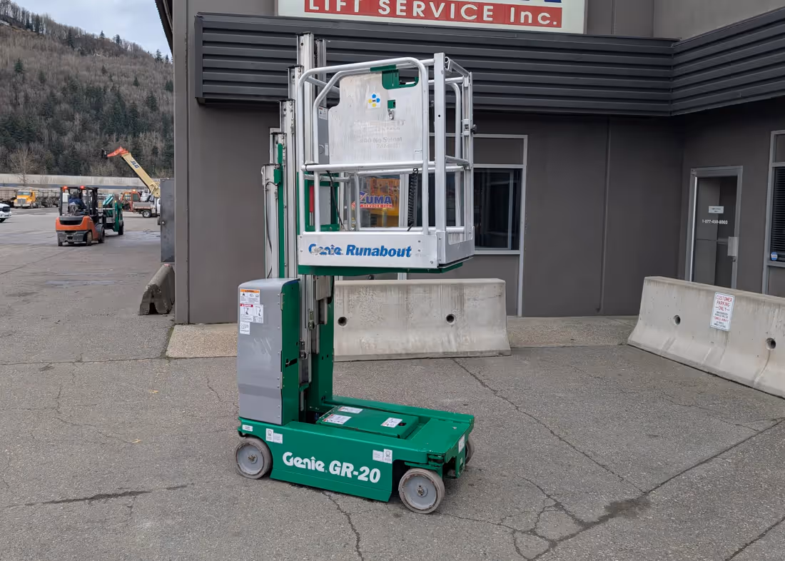 Genie GR-20 runabout lift mid-raise platform beside building in Canada