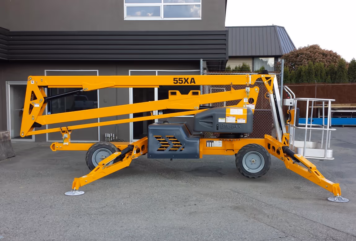 Haulotte 55XA boom lift with outriggers fully deployed in Canada