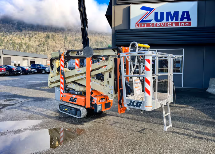 JLG X500AJ articulating crawler boom lift rear angle showing platform in Canada