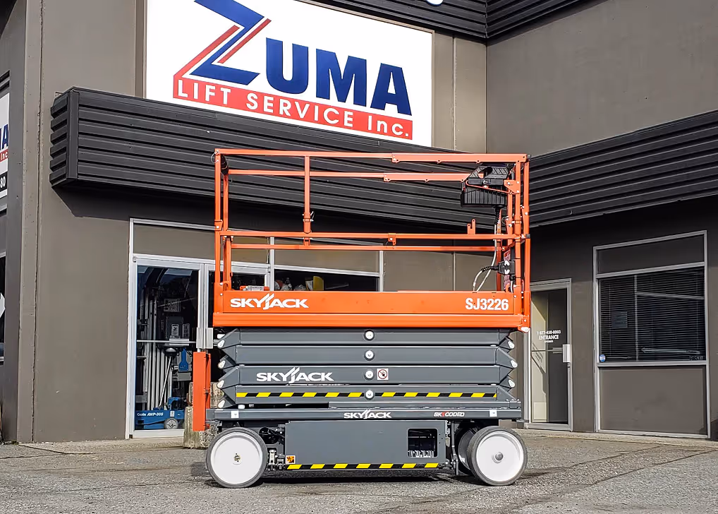 Skyjack SJ3226 electric scissor lift parked outside service center in Canada