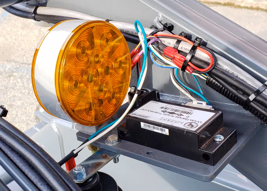 Skyjack SJ3226 LED warning light and wiring detail mounted on frame in Canada