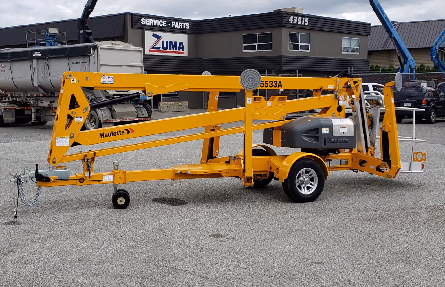 Haulotte 5533A towable boom lift opposite side view with hitch in Canada