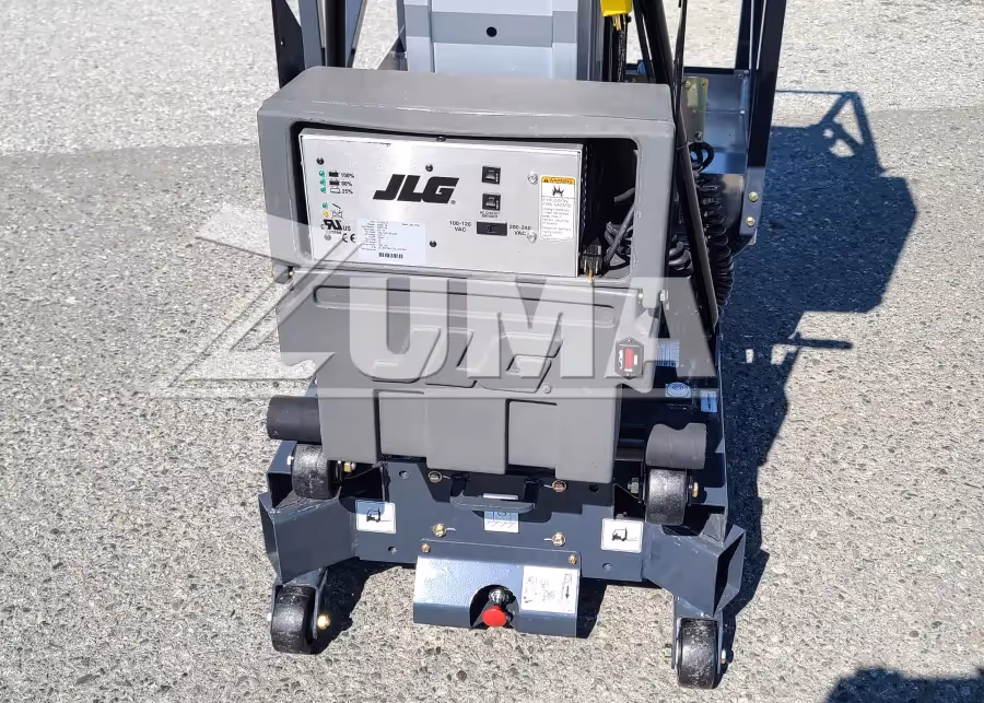 Close-up of JLG 25AM battery charger and base wheels