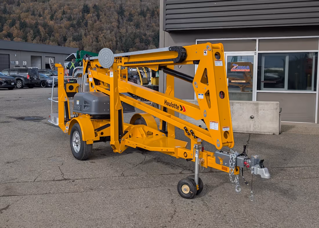 Haulotte 4527A towable boom lift angled view stowed at Zuma in Canada