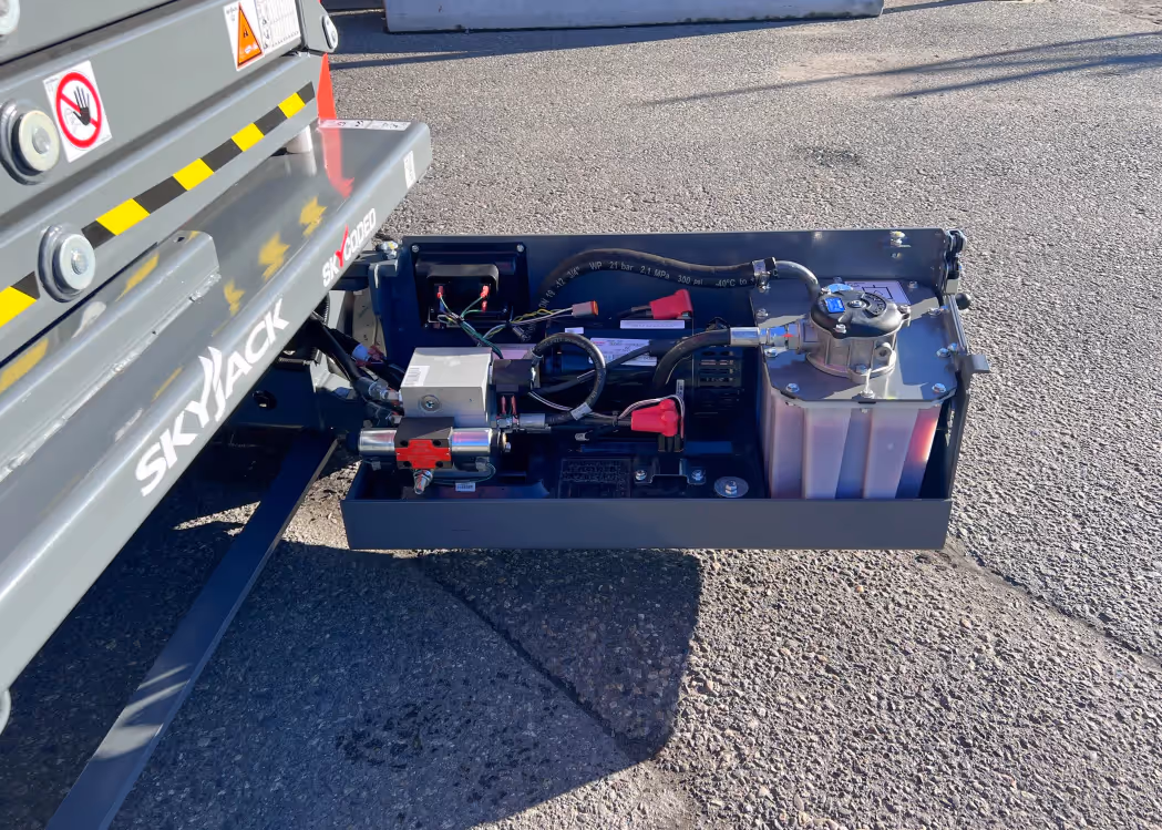 Skyjack SJ3219 E hydraulic component tray extended for access in Canada