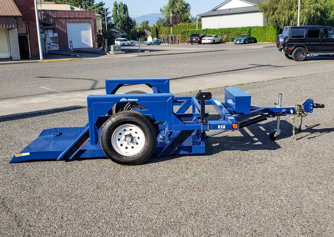 Air-Tow S8-35 utility trailer driver side profile with ramp partially lowered in Canada