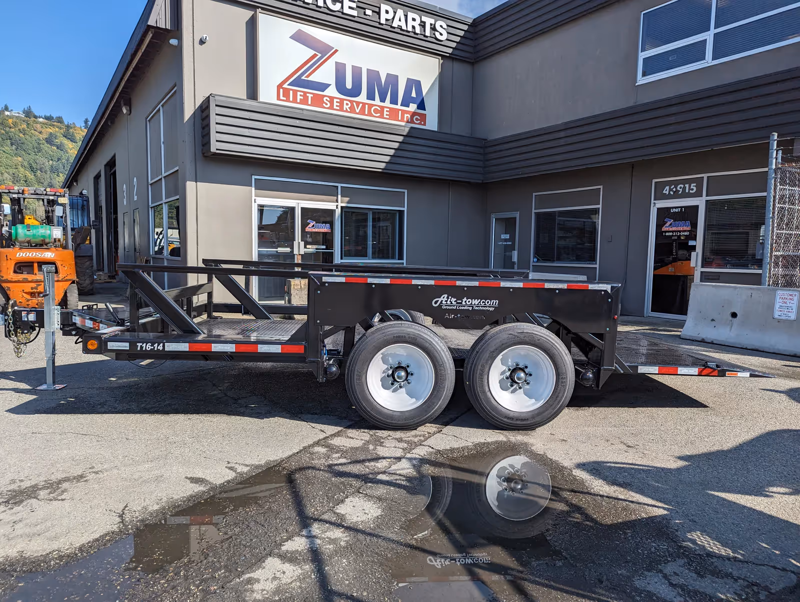 Air-Tow T16-14 trailer side view stowed at Zuma Lift Service in Canada