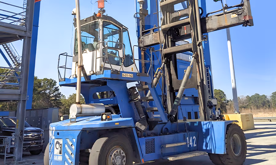 blue large fork lift at port loading dock