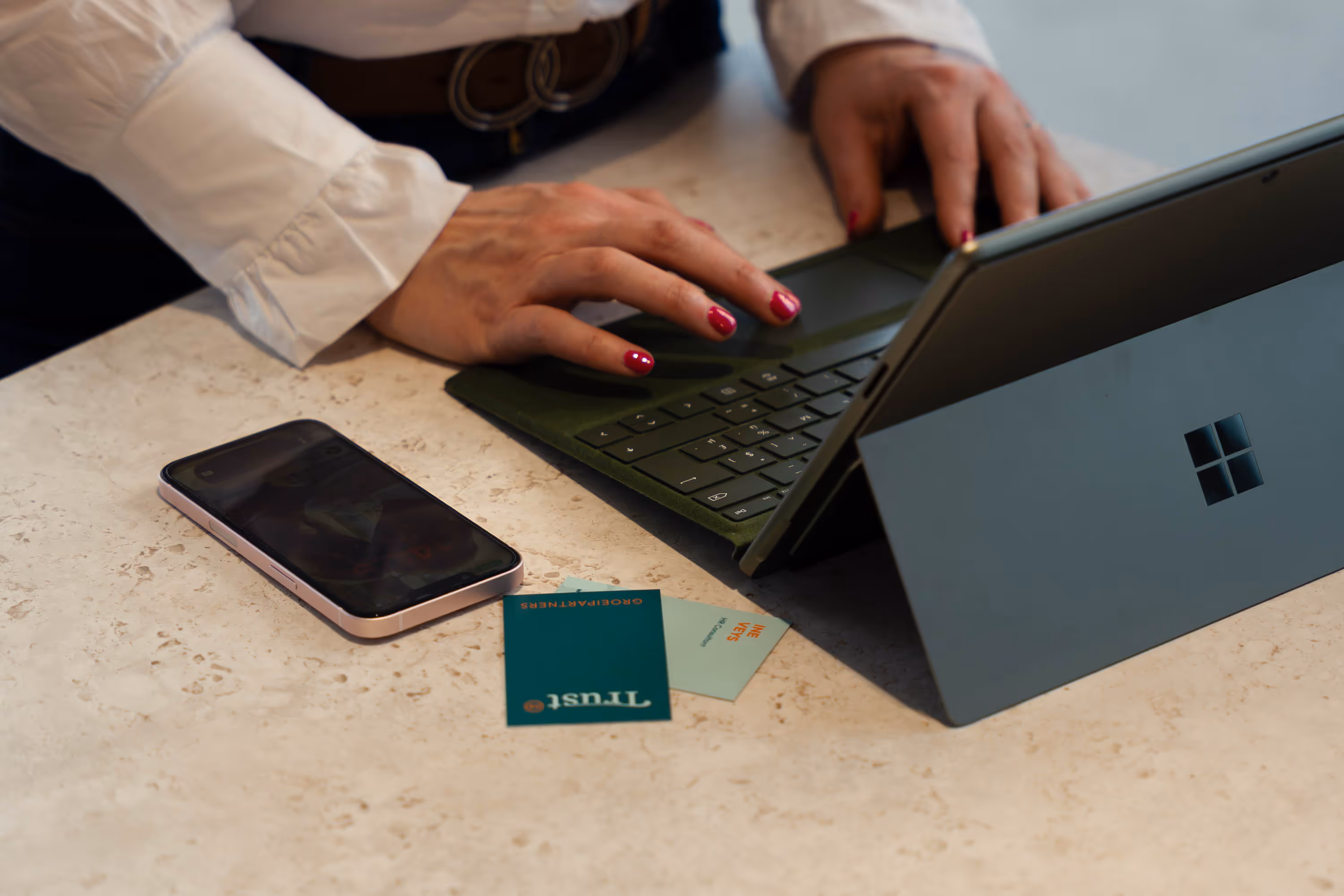 A lady typing on laptop
