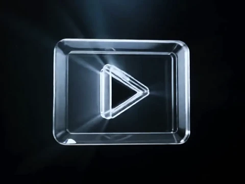 Transparent 3D rectangular glass button with a glowing play icon in the center on a dark background.