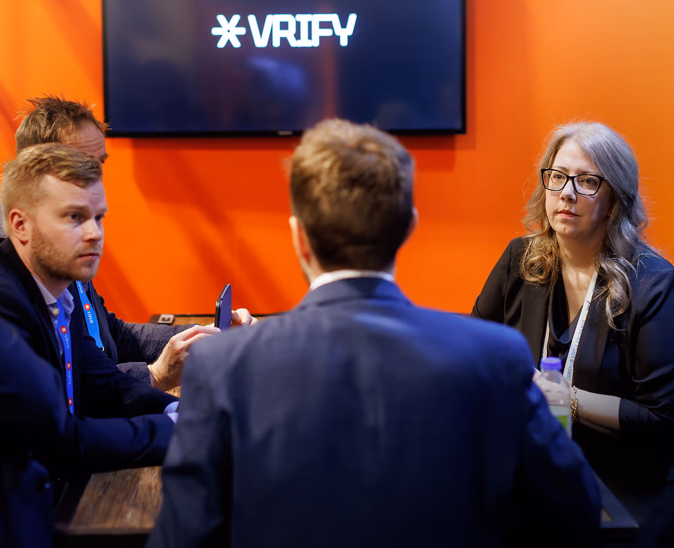 VRIFY team meeting with prospects at an event