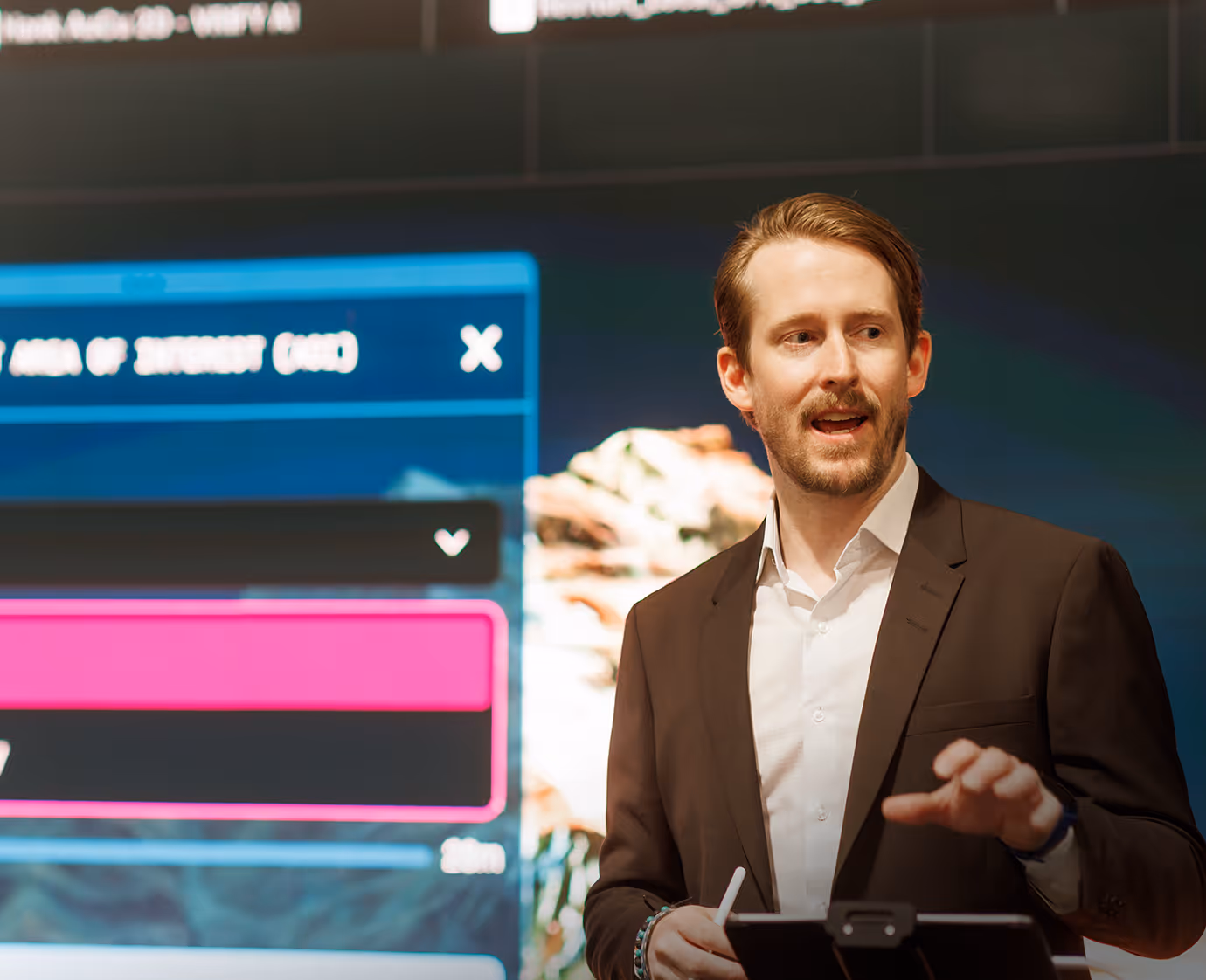 Presenter delivering VRIFY Predict results on a large screen